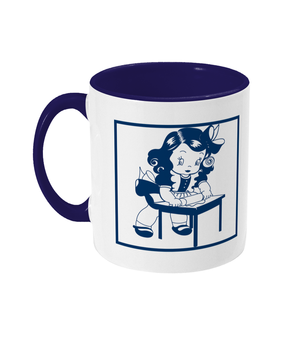 two tone blue and white ceramic mug git rolling out something standing ata table
