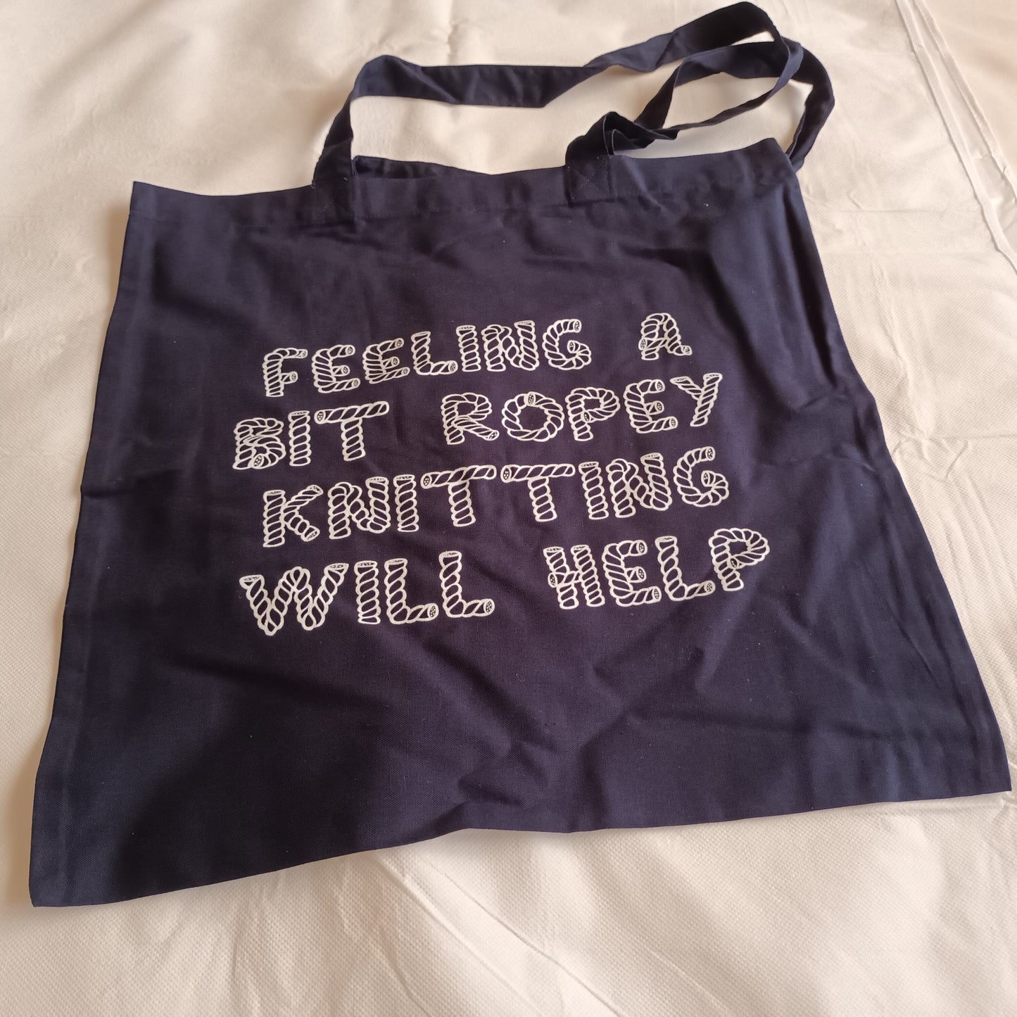 navy tote bag white print feeling a bit ropey then knitting will help
