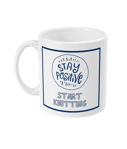 mug with stay positive images and the words start knitting underneath