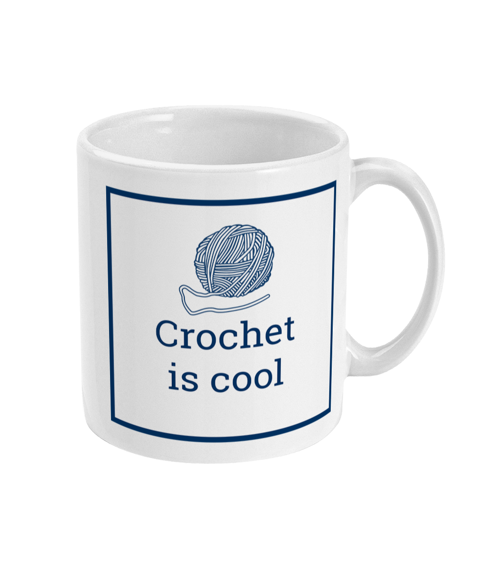 white mug with crochet is coll printed on it together with a ball of yarn