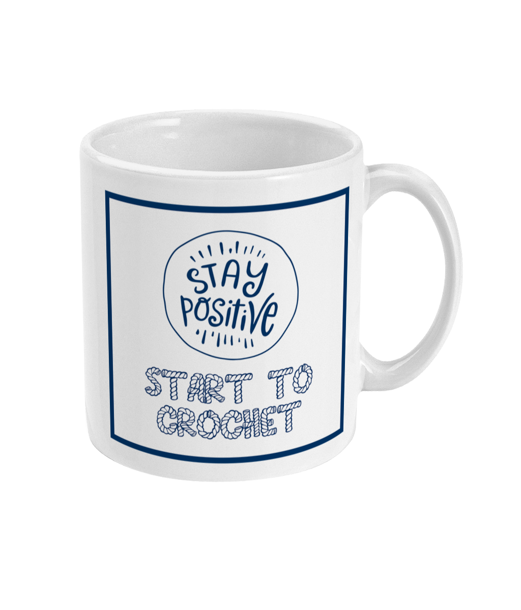 mug with stay positive images and the words start to crochet underneath
