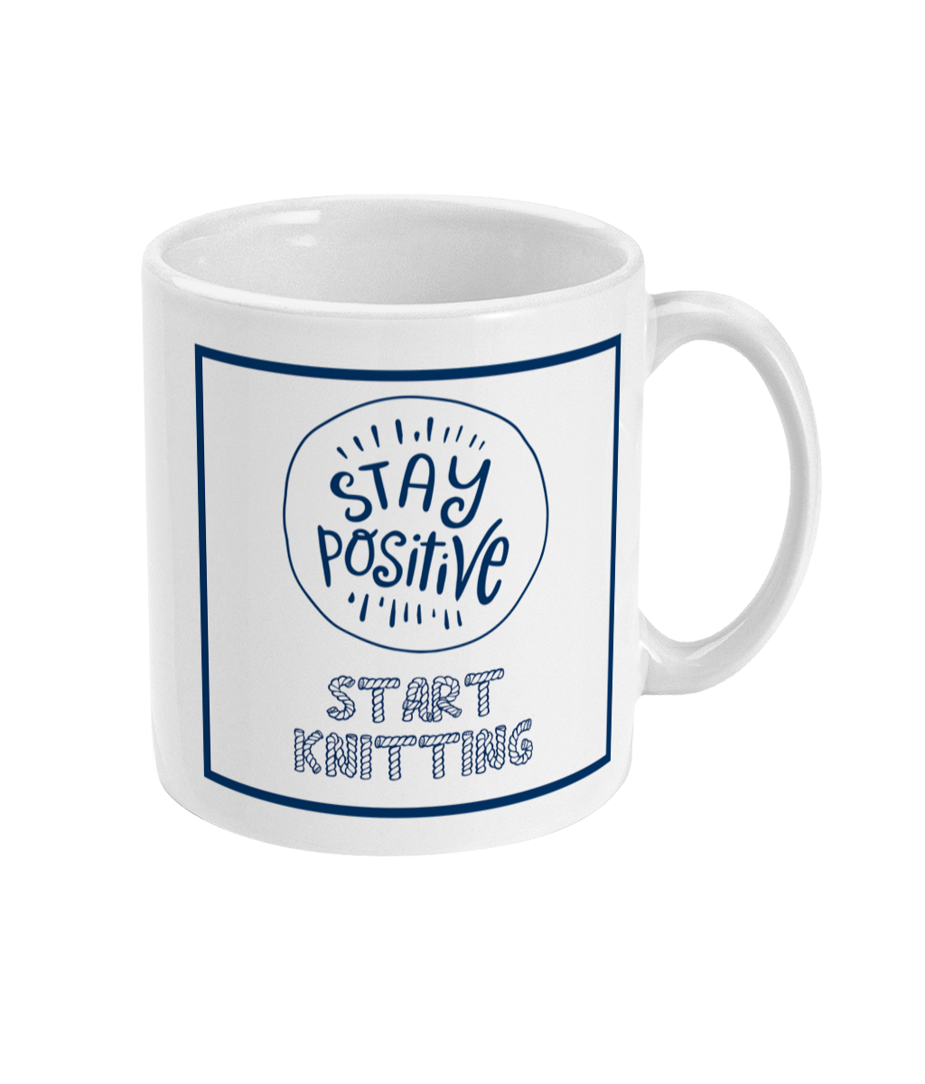 mug with stay positive images and the words start knitting underneath